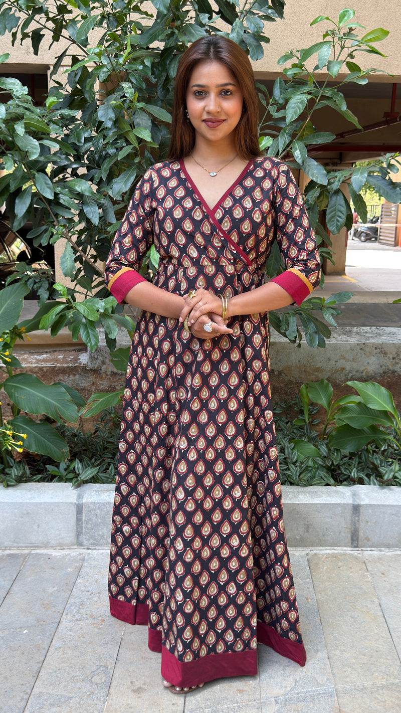 Side view of black handloom cotton long dress showing A-line drape