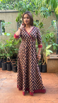 Detail of maroon V-neck contrast binding on black long dress