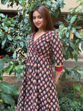 Close-up of maroon hem border on black handloom cotton dress