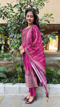 Close-up of embroidered border detail on magenta dupatta