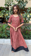 Red handloom cotton long dress with block printed body and black hem, full-length view