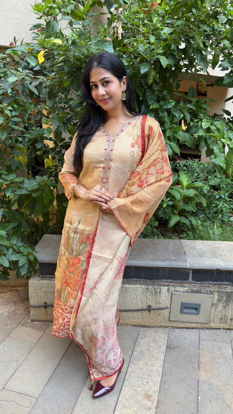 Three-quarter view of beige kurta set showing dupatta drape