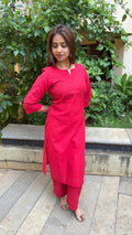 Three-quarter view of red handloom cotton kurta set