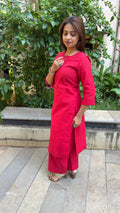 Detail of red handloom cotton fabric with slub texture