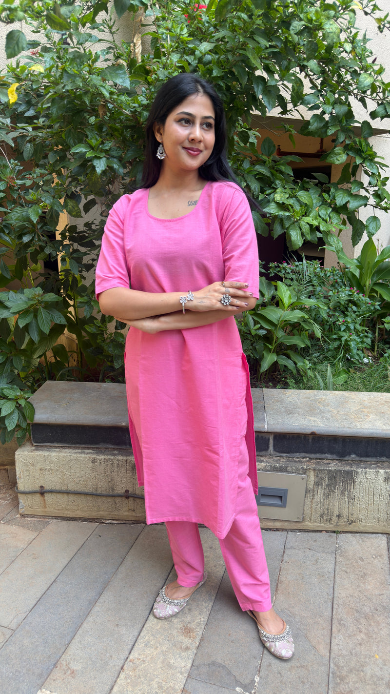 Front view of plain pink kurta showing clean silhouette and elbow sleeves