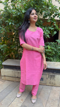 Three-quarter view of pink handloom cotton kurta set