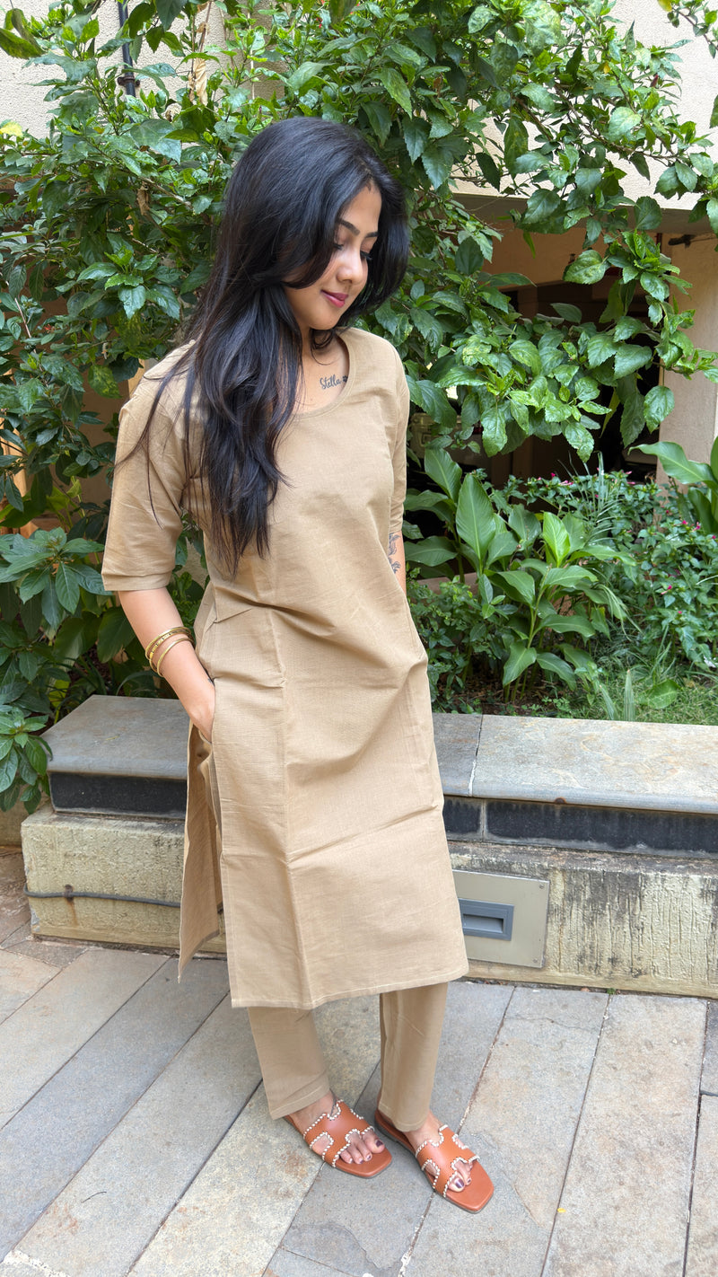 Three-quarter view of beige handloom cotton kurta set