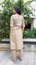 Side view of beige kurta showing regular fit and matching pants