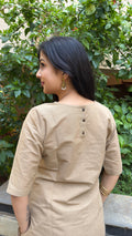 Detail of beige handloom cotton fabric with slub texture