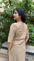Close-up of beige kurta round neckline