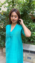 Full-length view of teal slub silk kurta palazzo set