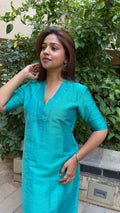 Close-up of teal kurta V-neckline