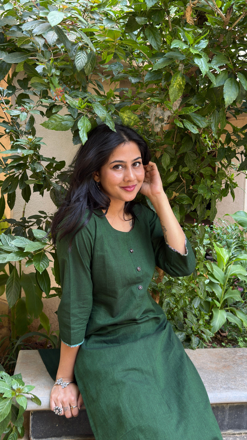 Front view of dark green kurta showing button placket detail