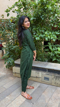 Close-up of dark green kurta neckline with button placket