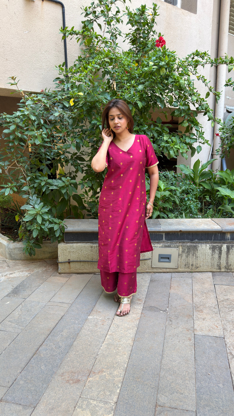 Three-quarter view of magenta slub silk kurta set