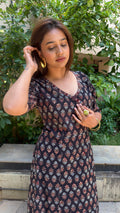 Full-length view of black V-wrap long dress in cotton with small block-printed buti