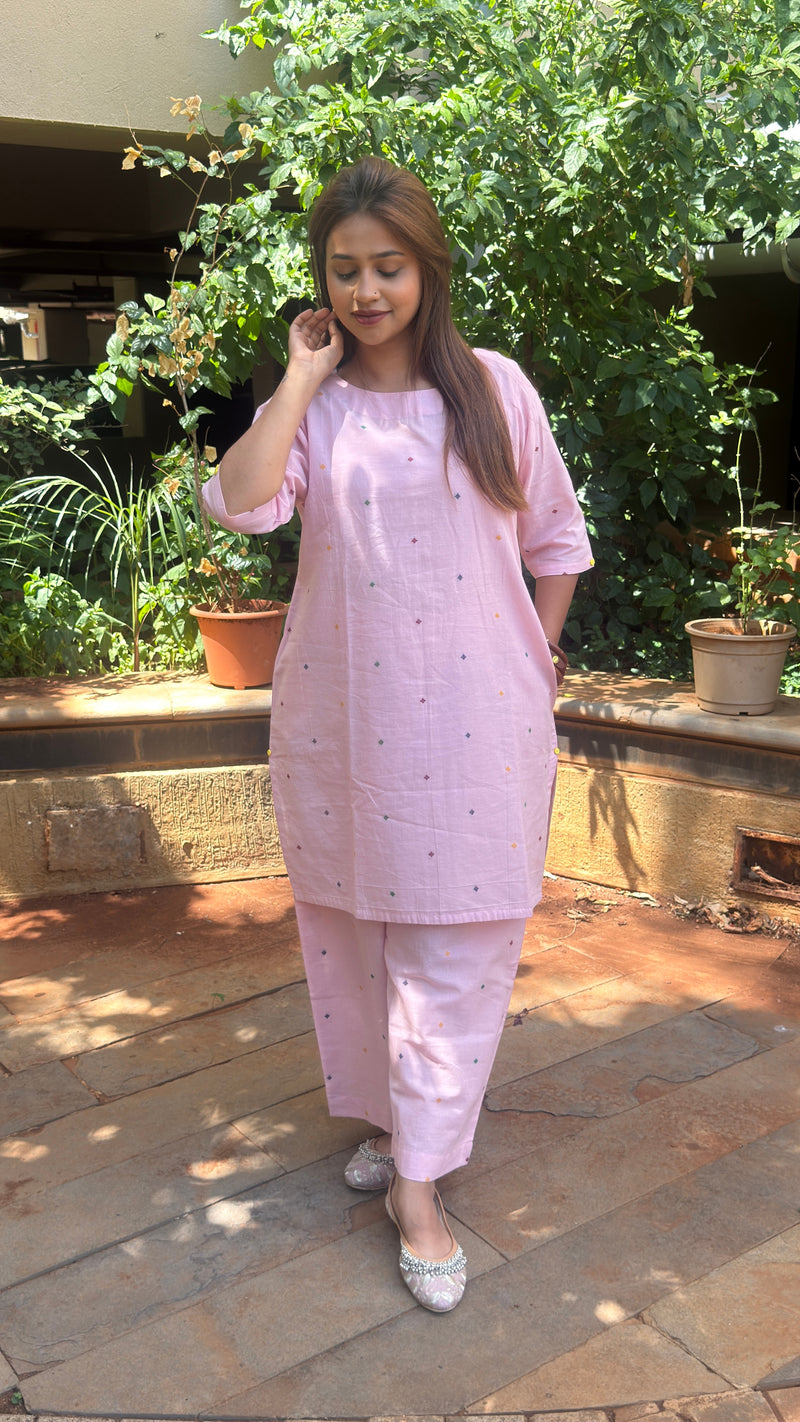 Front view of light pink printed kurta with round neckline