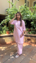 Three-quarter view of light pink handloom cotton kurta set