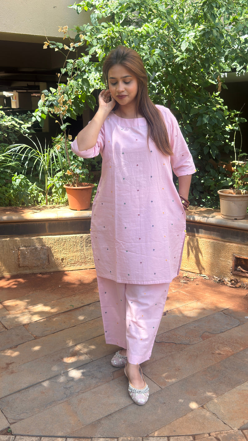 Side view of light pink kurta showing relaxed fit and matching pants