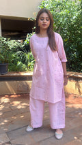 Close-up of light pink kurta neckline