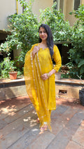 Detail of chikankari embroidered border on yellow dupatta