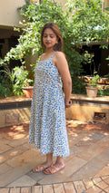Front view of sleeveless blue floral block print dress with A-line silhouette