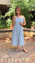 Detail of small blue floral buti motifs hand block printed on white cotton