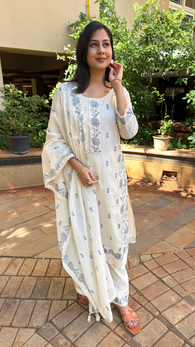 Three-quarter view of ivory mul cotton kurta set with dupatta
