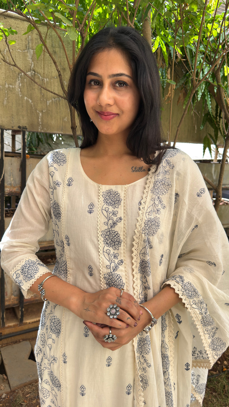 Side view of ivory kurta showing embroidered motifs and dupatta drape