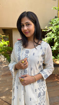 Detail of grey embroidered motifs on ivory mul cotton