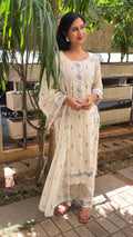 Detail of crochet lace trim at hem of ivory kurta