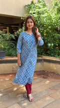 Side view of blue printed kurta showing fit and maroon pants