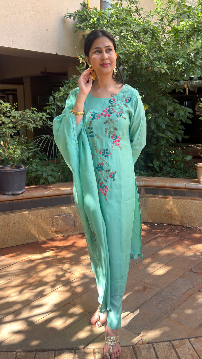 Three-quarter view of mint art silk kurta set with matching dupatta