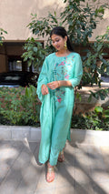 Close-up of mint kurta yoke and embroidered florals