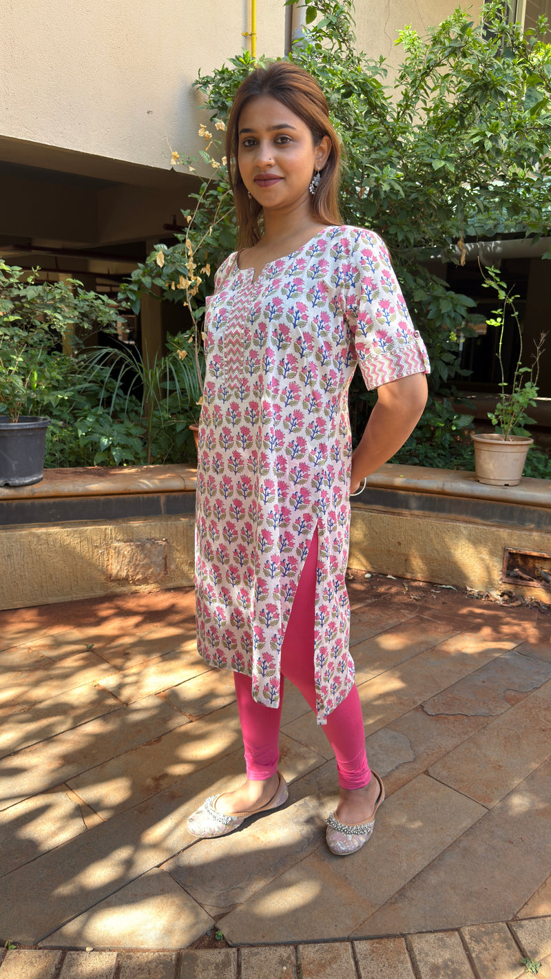 Front view of white block print kurta with V-neckline and embroidered detail