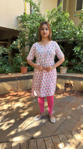 Full-length view of white block print kurta with pink leggings