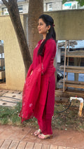 Front view of maroon kurta with white embroidery and dupatta draped over shoulder