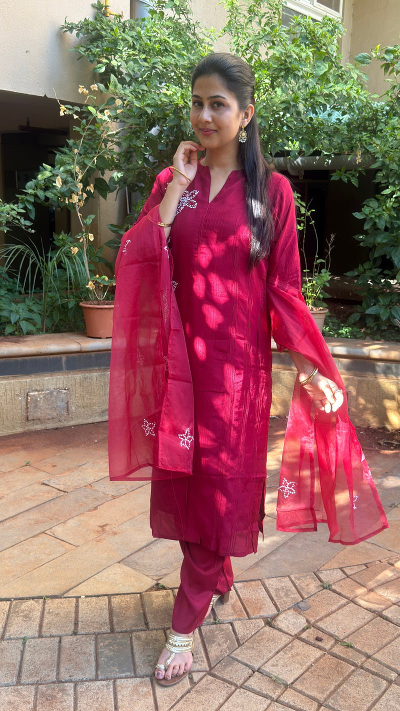Side view of maroon kurta showing dupatta drape and embroidered detail