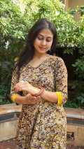 Olive long dress with mustard contrast band at sleeve cuff, close view