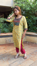 Full-length view of yellow Ajrakh kurta set with maroon pants