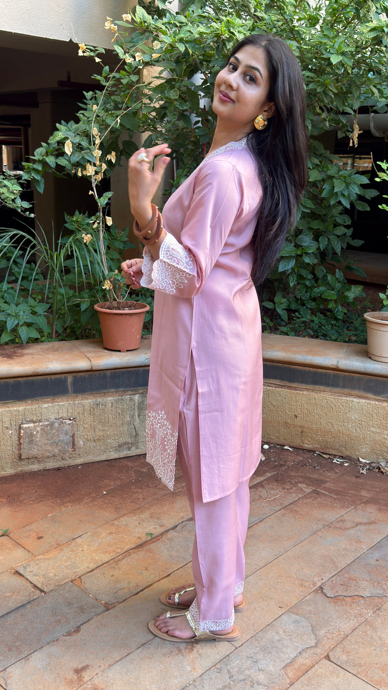 Three-quarter view of pink cotton kurta set with sleeve cuff trim
