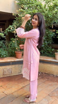 Full-length view of pink cotton kurta set in natural light