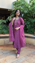 Three-quarter view of mauve cotton-silk kurta set in natural light