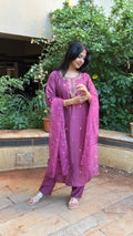 Side view of mauve kurta with sheer dupatta and matching pants