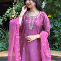 Back view of a woman in a mauve cotton-silk kurta set, showing the clean silhouette and drape of the lightweight dupatta.