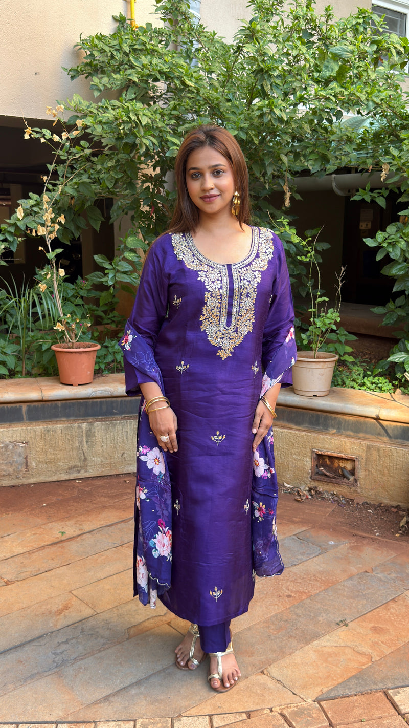 Front view of purple kurta showing embroidered yoke and bold floral dupatta drape