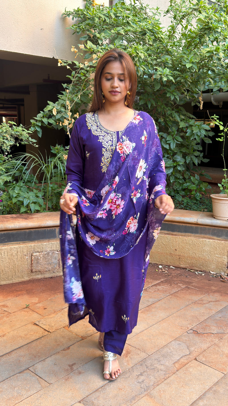 Three-quarter view of purple kurta set with screen-printed floral dupatta