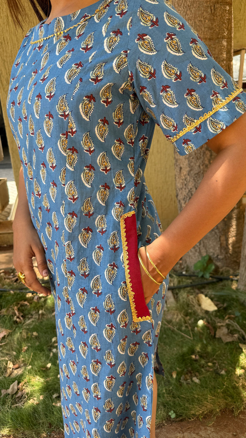 Front view of blue block print calf-length dress with ghota patti lace at neckline