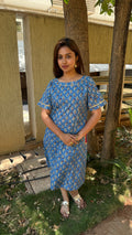 Detail of buti block print and ghota patti lace on blue cotton