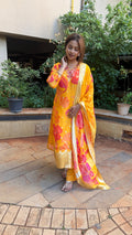 Front view of yellow kurta with subtle embroidered detailing and floral printed dupatta